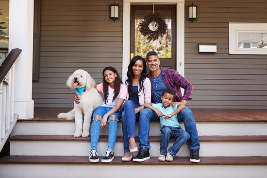 family sitting on porch